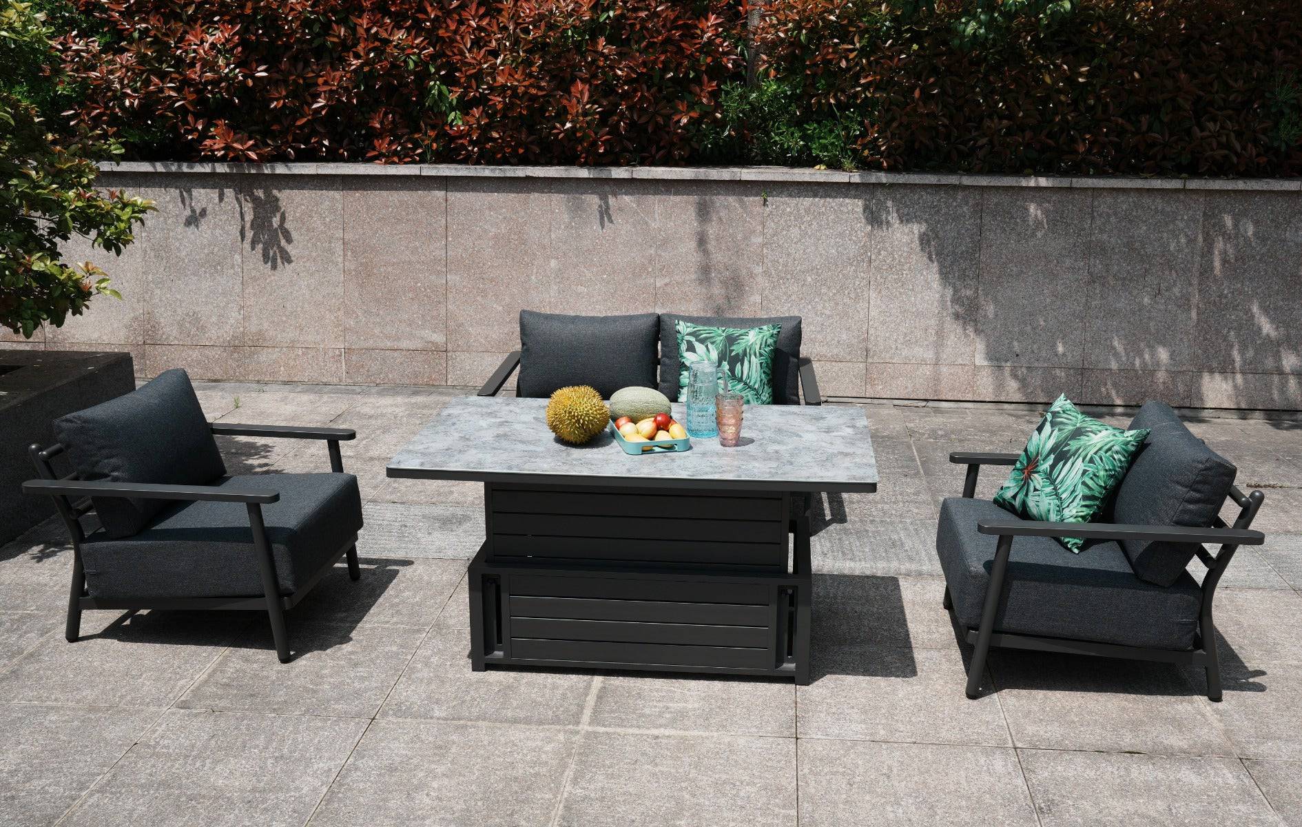 Glass-topped rising table with aluminum frame accompanied by four chairs