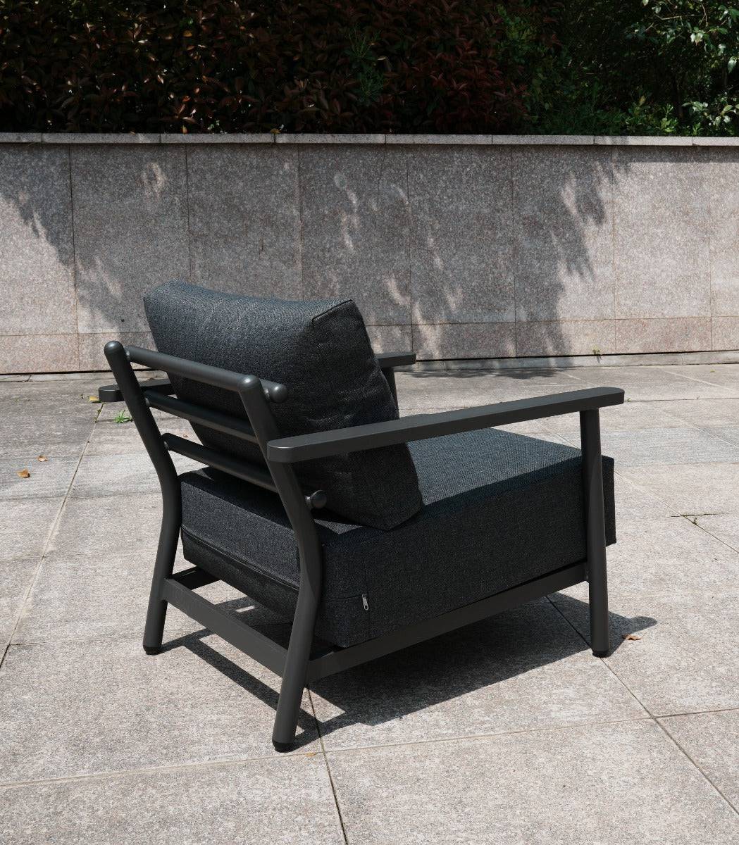 Black aluminum lounge chair from the 4-seat sofa set on a patio