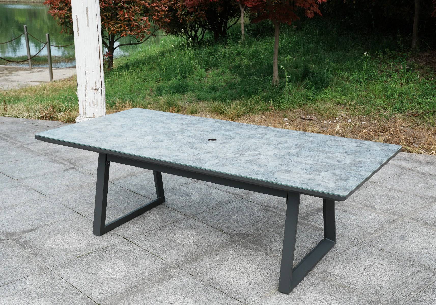 Aluminum dining table showcasing its elegant patterned design and sturdy black base