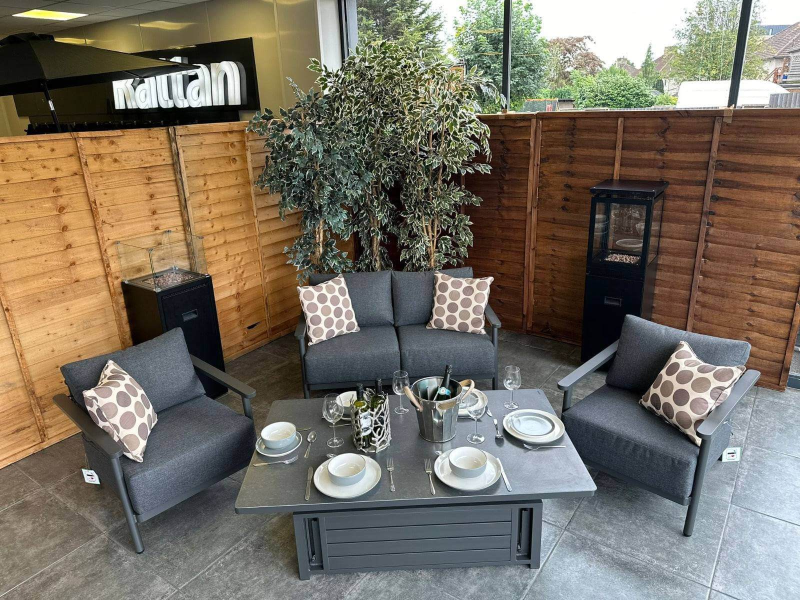 Aluminium 2 Seat Sofa Set with grey upholstery and a patterned rising table beside a tree